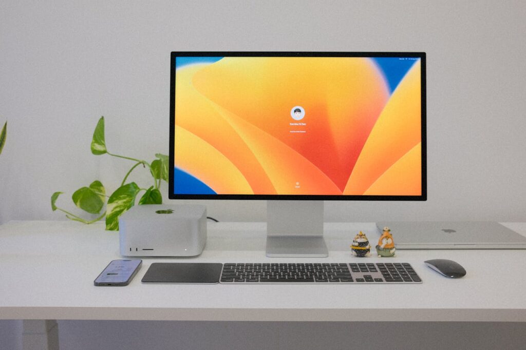 pexels photo 18024475 A clean and organized modern office desk setup with tech gadgets and decor.